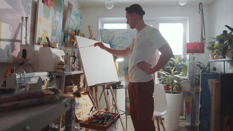 Artist-Drawing-Picture-on-Canvas-in-Art-Studio