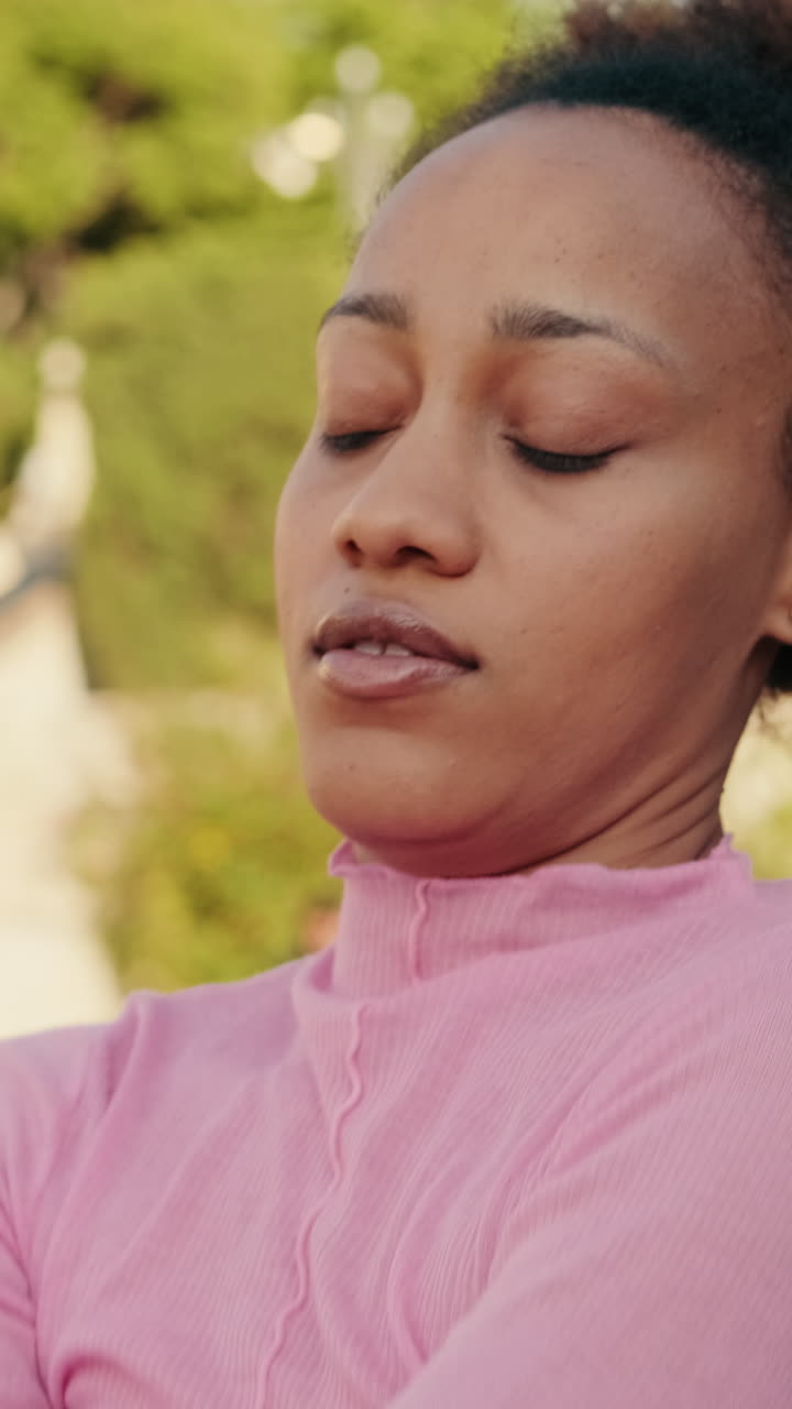 Young Woman Dances Gracefully in City Park