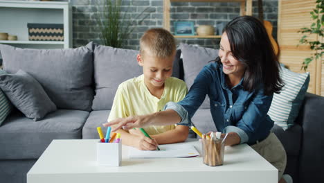 mother and son coloring together