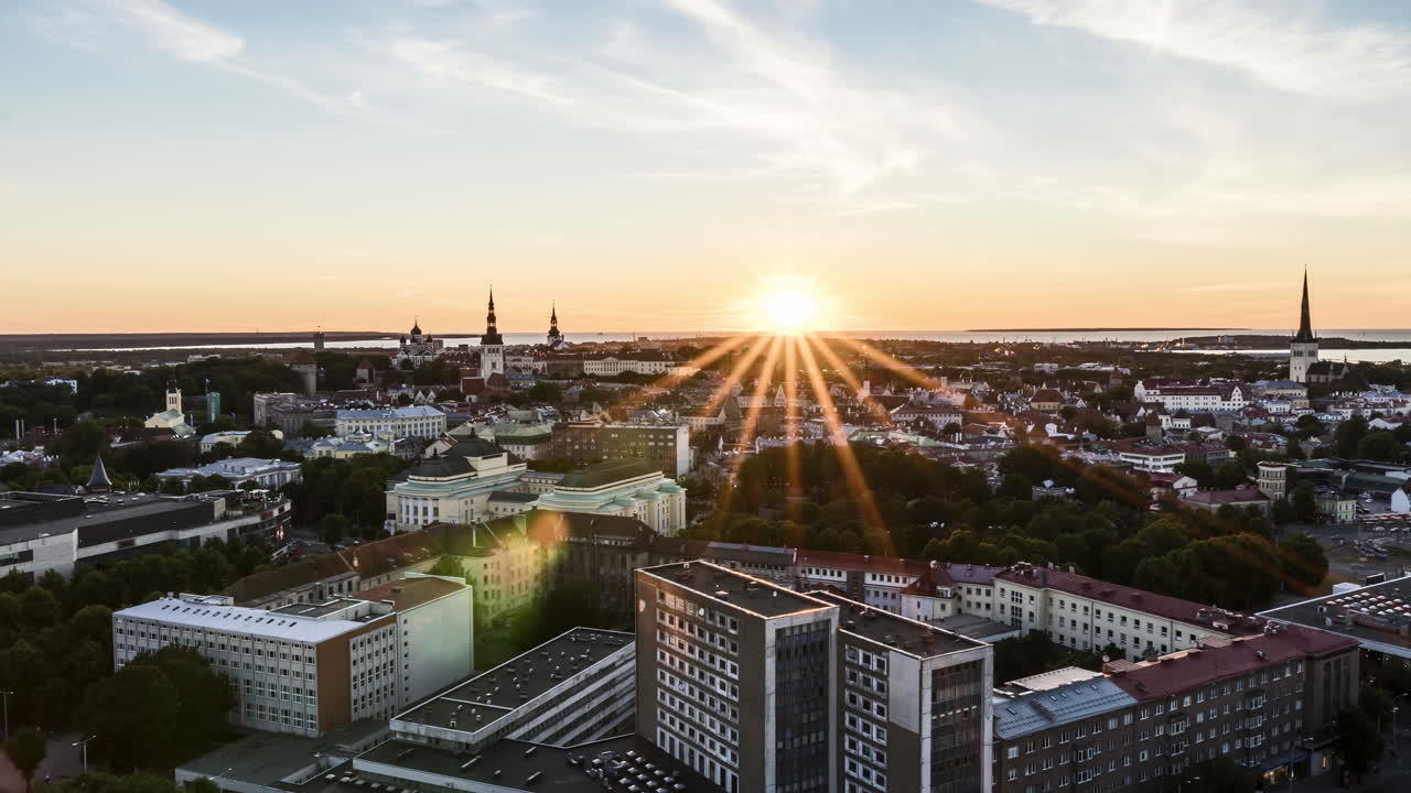 Tallinn sunset timelapse. View over old town and sea horizon. Static shot.