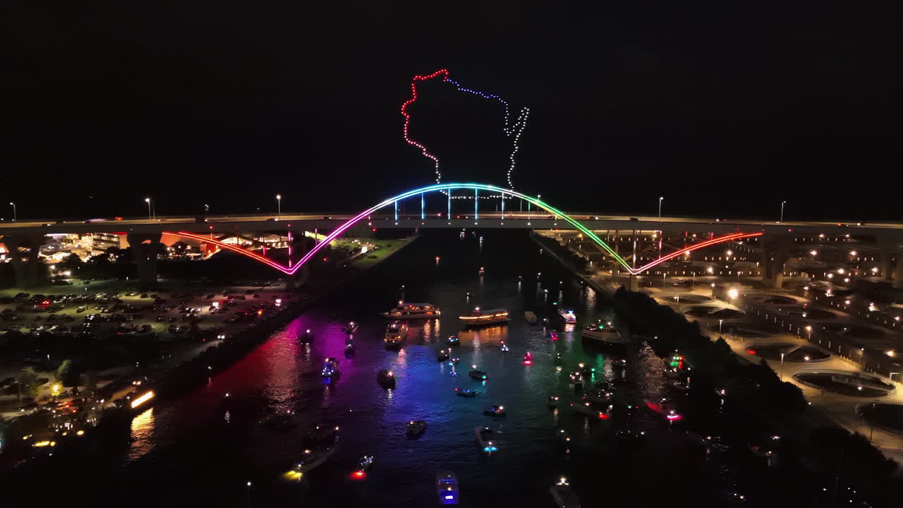 Hoancoming event in Milwaukee, vivid night lit Hoan bridge and a drone light show