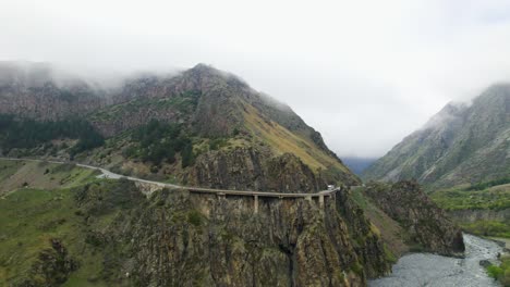 Dangerous-mountain-road-through-Georgia-Kazbegi-Mountain,-Aerial