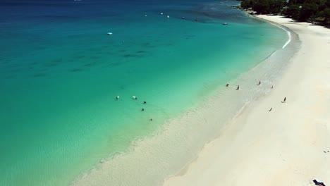 mahe seychelles clients on the beac, enjoying there day on the beach, and arriving rain cloud