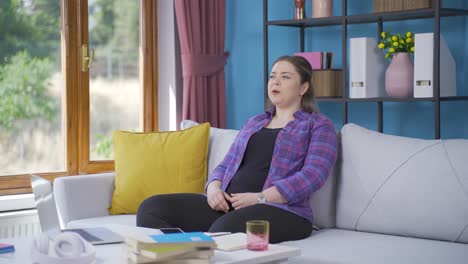 calm and peaceful young woman. the young woman is resting at home.