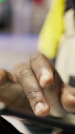 vertical video close up of tablet used by smart factory specialist