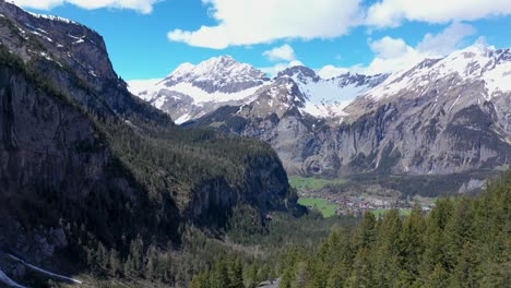 drone flight over a beautiful alpine glacier valley and vast mountainous landscape