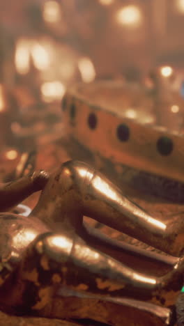 close-up of a golden buddha statue