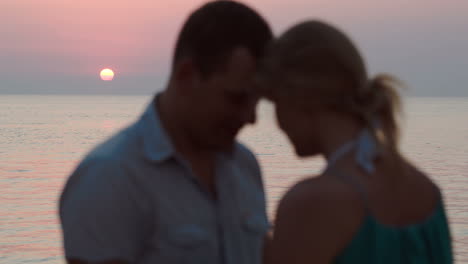 loving couple on the beach during sunset