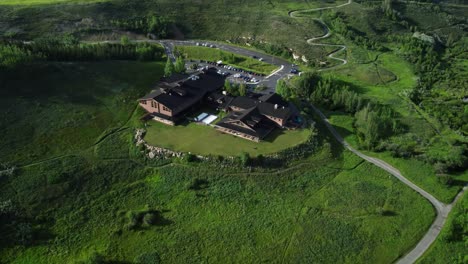 Revealing-drone-shot-of-the-Cochrane-RancheHouse-in-summer-time
