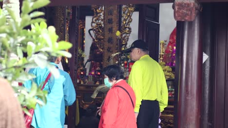 people exploring den ngoc son temple interior