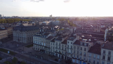 historic building facades in bordeaux, aerial rising during sunset