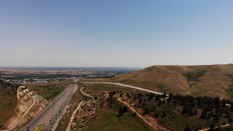 A-scenic-drone-shot-over-the-hogsback,-Golden-Co,-showing-I-70-leading-into-Denver