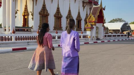 women walking in thai temple