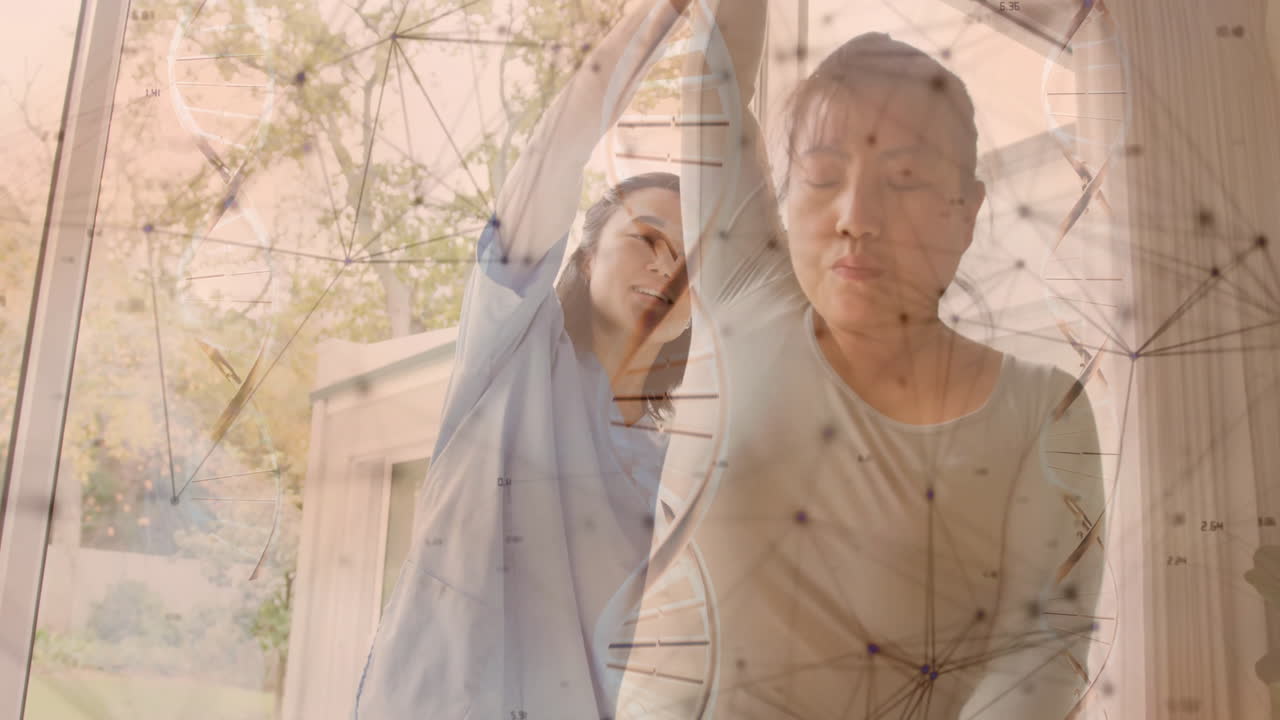 Animation of dna strand and medical data processing over diverse female physiotherapist and patient