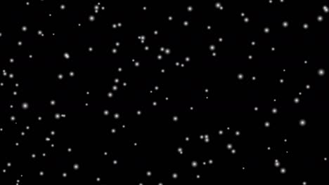 loop animation of fluffy snow falling, black background