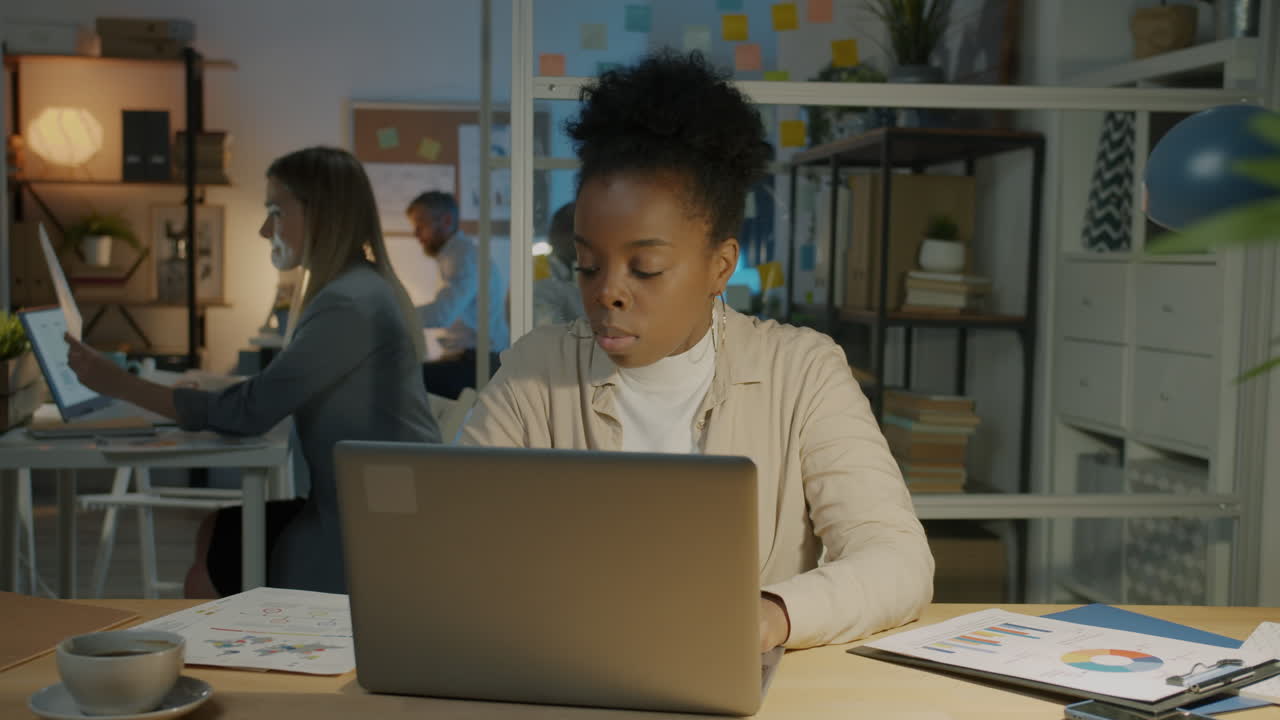 Woman working late in office