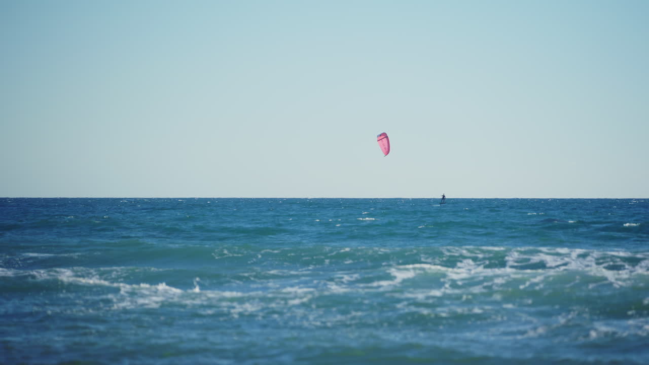 Mediterranean Sea with isolated kitesurfer in slow motion