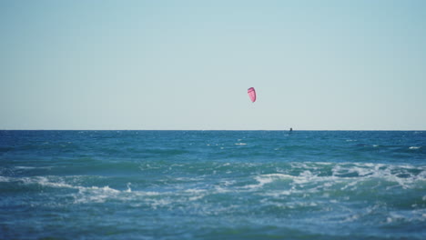 mediterranean sea with isolated kitesurfer in slow motion