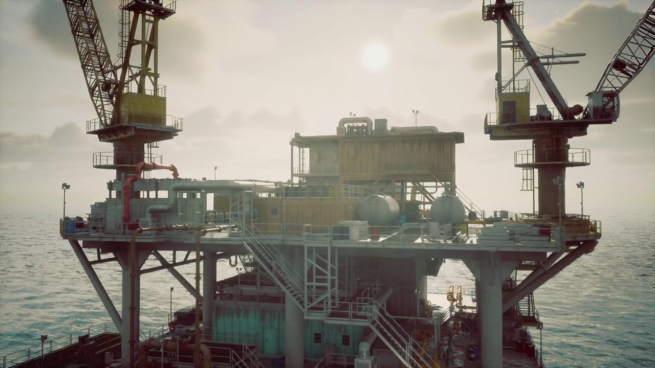 Stille offshore vedligeholdelsesdæk med kraner og gangbroer ved solopgang.