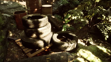 old-used-wheels-in-the-tropical-forest-as-pollution-concept