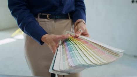 woman choosing paint colors for a new home renovation