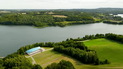 aerial view of brodno wielkie lake in poland on a cloudy day - drone shot