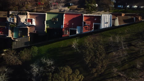 view over the roofs from above, the road next to the house, colored floor