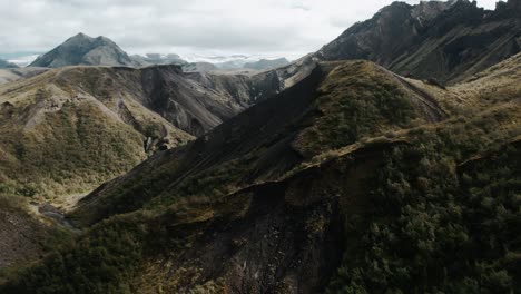 Aerial-thor-valley-grassy-forest-mountain-ranges,-famous-icelandic-national-park-landmark-landscape