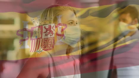 Animación-De-La-Bandera-De-España-Ondeando-Sobre-Una-Mujer-Con-Mascarilla-Durante-La-Pandemia-De-Covid-19