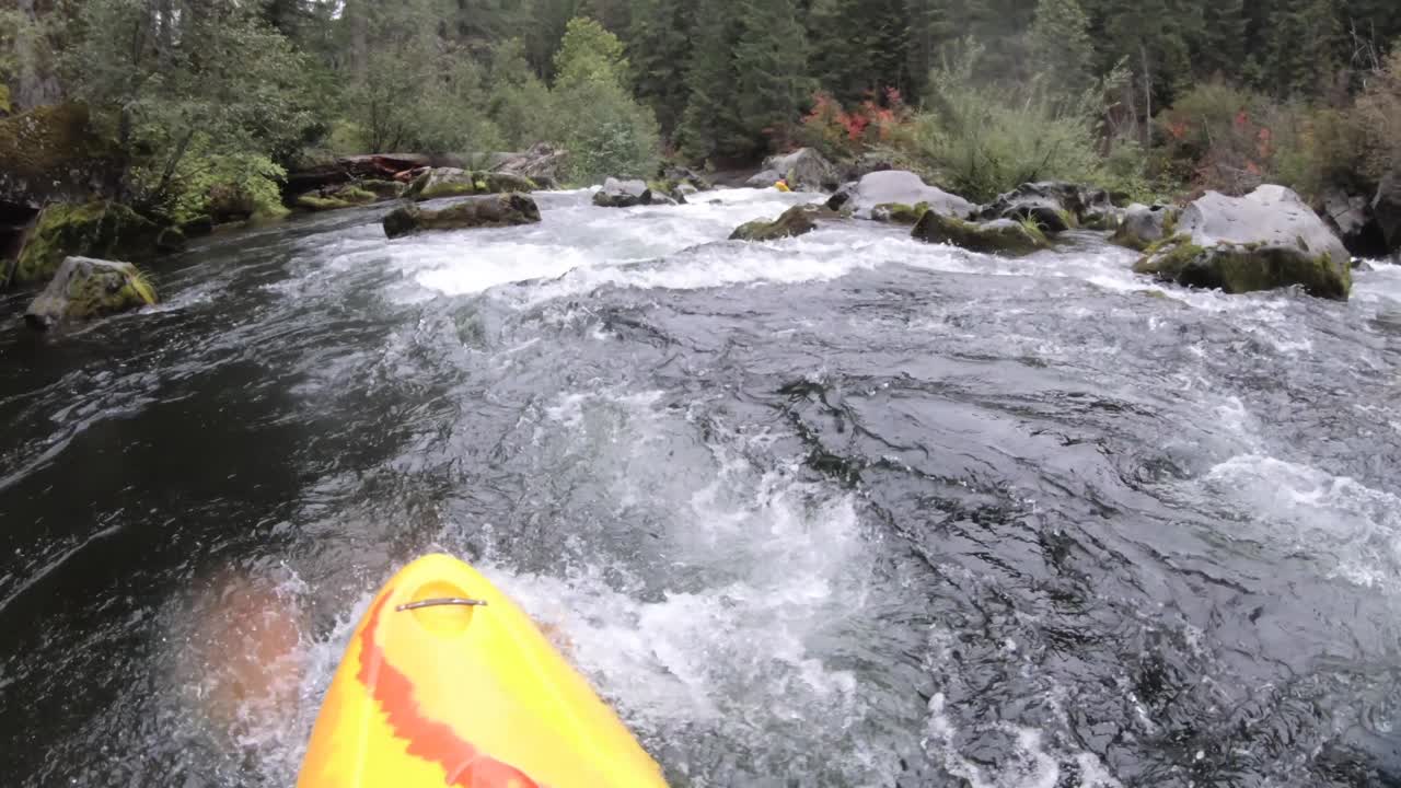 Whitewater kayaking the Class IV Natural Bridge section of the upper Rogue River in Southern Oregon