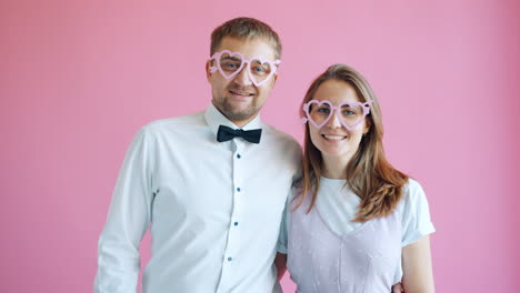 couple wearing heart glasses