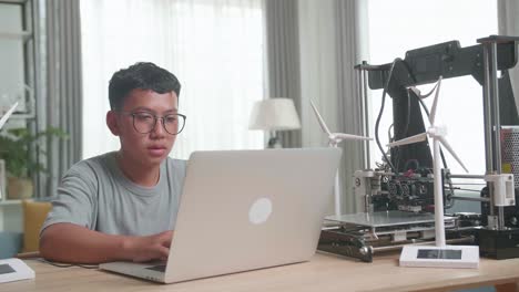 boy learning about 3d printing and renewable energy