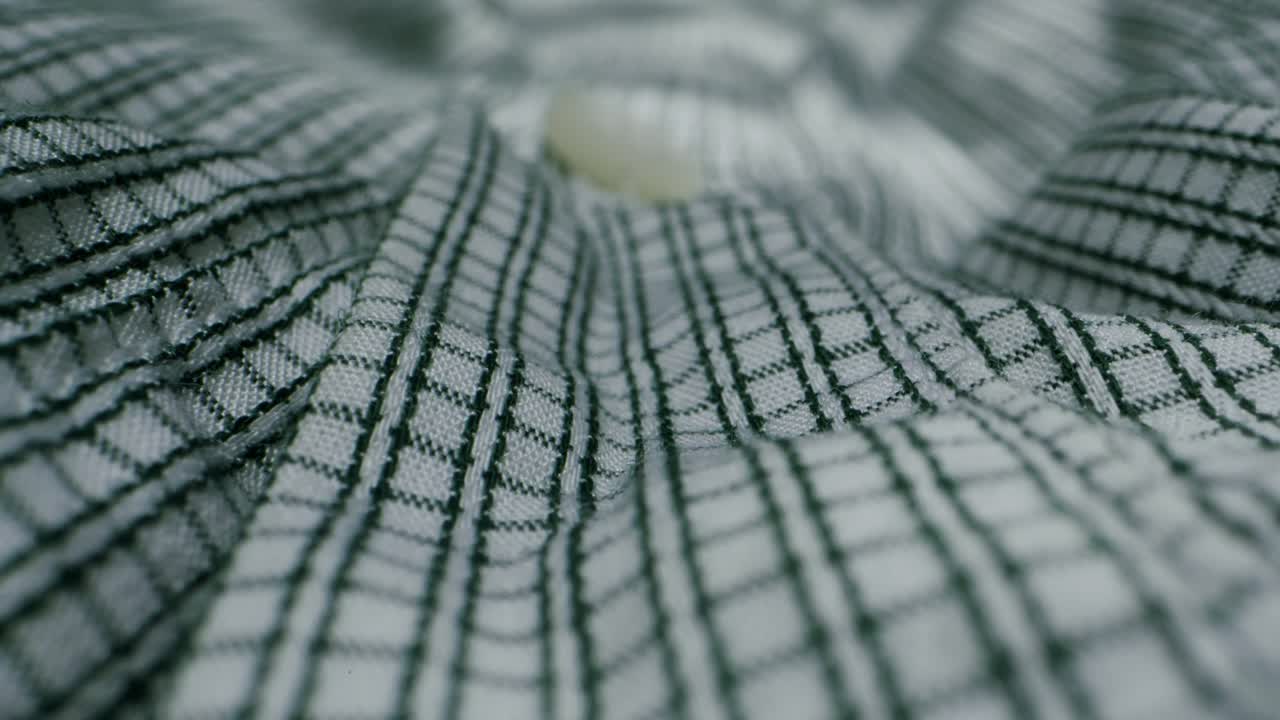 Closeup of an expertly tailored suit that beautifully showcases its sophisticated buttons and fine fabric texture