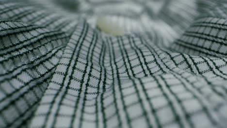 closeup of an expertly tailored suit that beautifully showcases its sophisticated buttons and fine fabric texture
