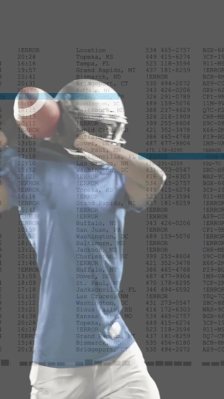 Vertical video: Helmeted player securing ball, scanning ahead while sports data scrolling over him