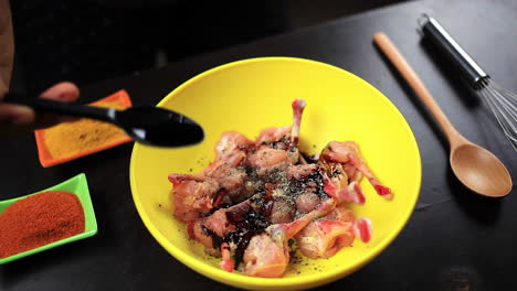 after mixing the black pepper with fresh cutting chicken chef add black soy sauce with that for prepare food