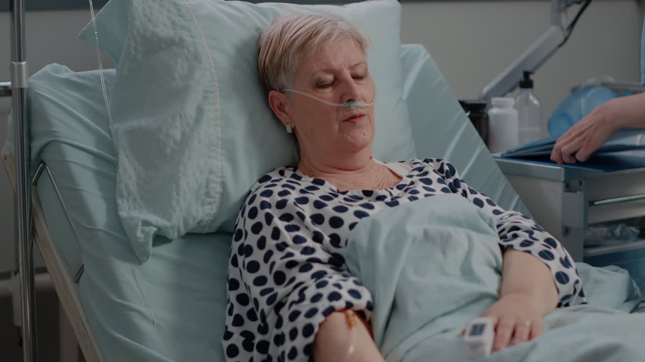 Woman with sickness waiting for medical treatment in bed