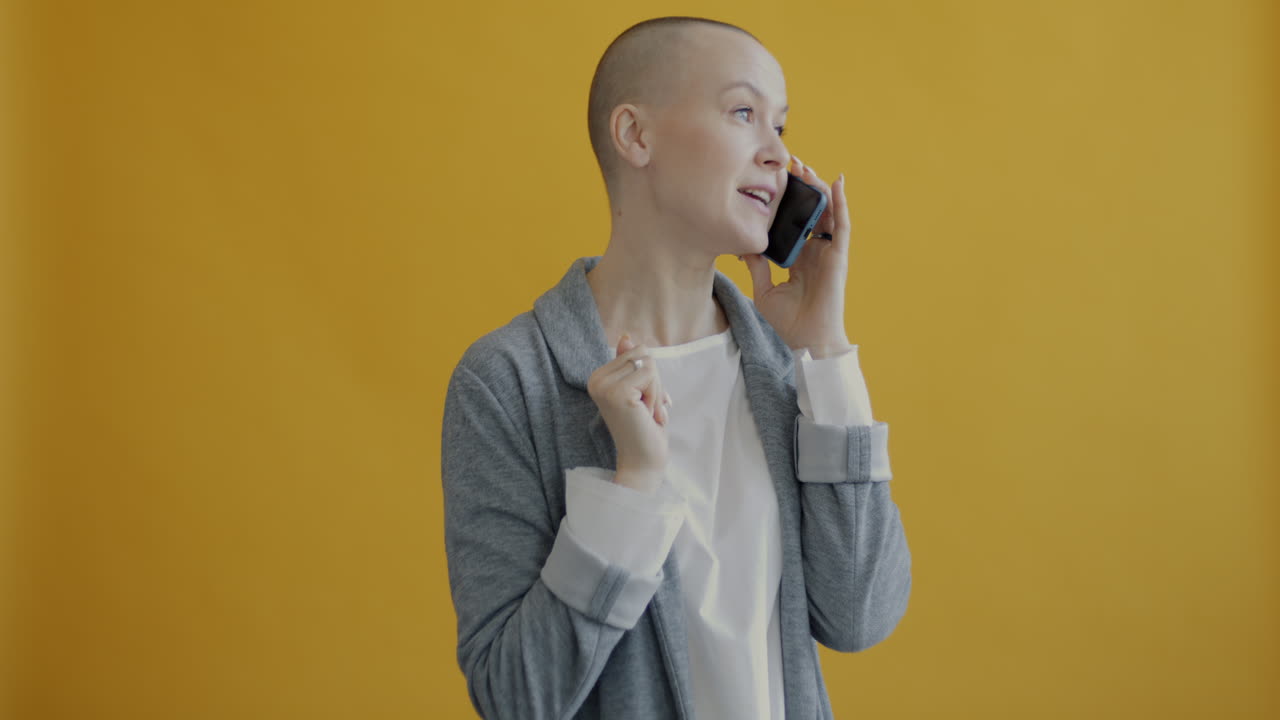 Woman on Phone in a Grey Blazer