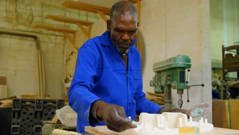 worker working on molds in foundry workshop 4k