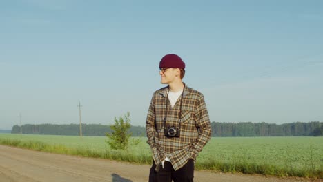 man taking pictures in a field