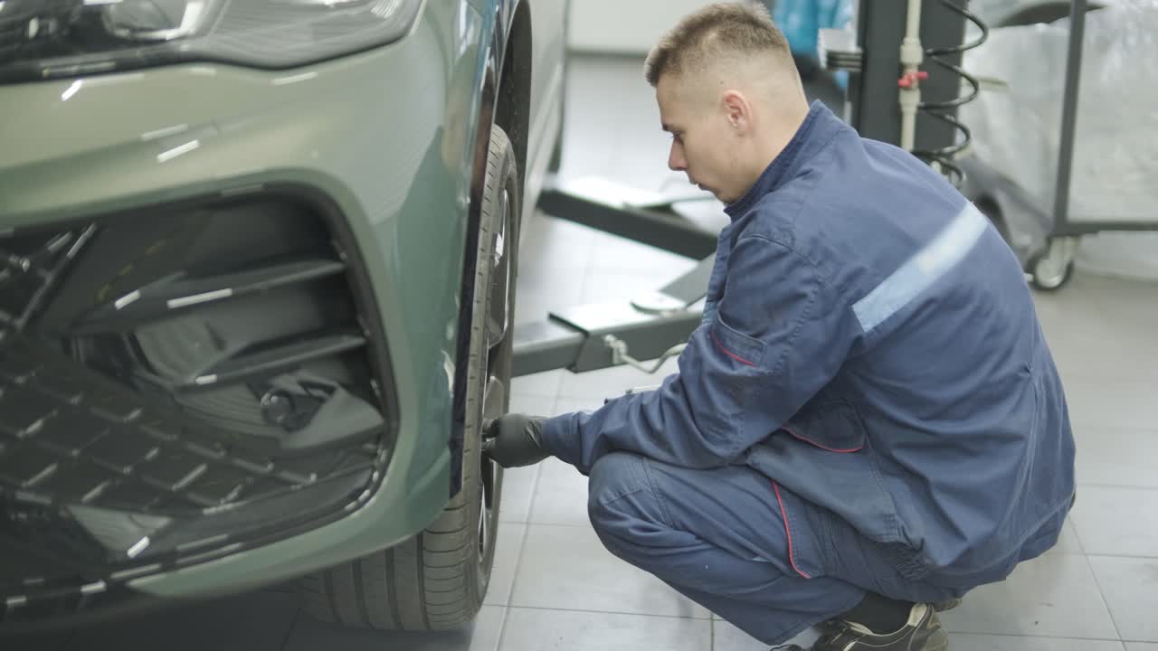 Mechanic working on a car tire
