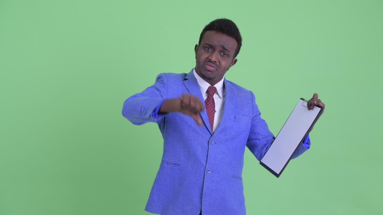 Young African businessman with Afro hair in suit