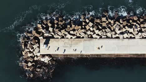 a large, concrete dock and breakwater as seen directly from above
