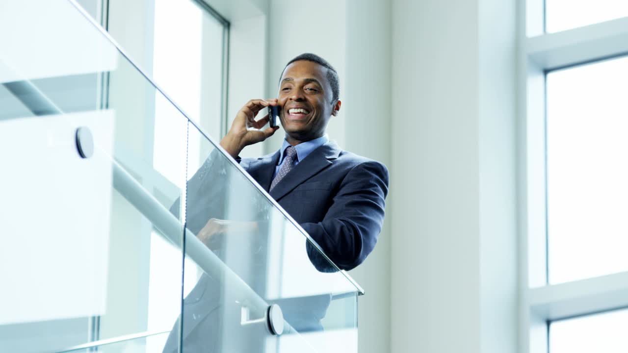 African American male business advisor using smart phone
