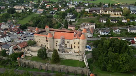 orbit drone shot close to grandson castle next to lake neuchatel in canton of vaud in switzerland