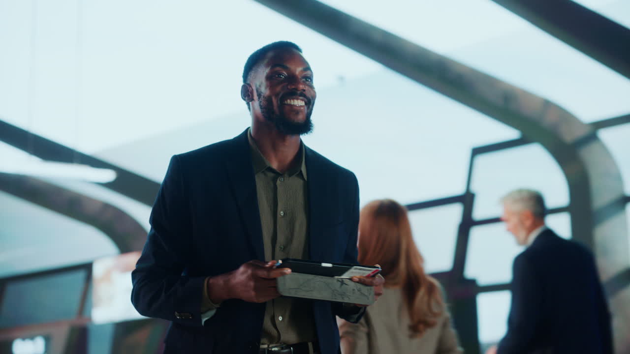 A businessman using a tablet at the airport