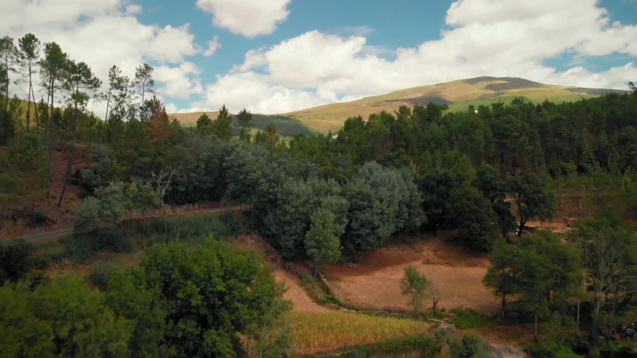 River with a Car in a Stone Bridge in a Summer Dav
