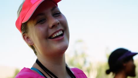 Portrait-of-happy-woman-in-boot-camp