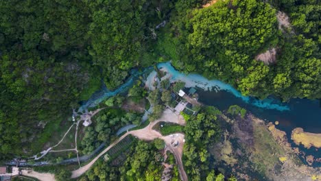 Aerial-shot-and-drone-view-of-the-cold-water-river-of-The-Blue-Eye-or-Syri-i-kalter-in-the-mountains-of-southern-Albania