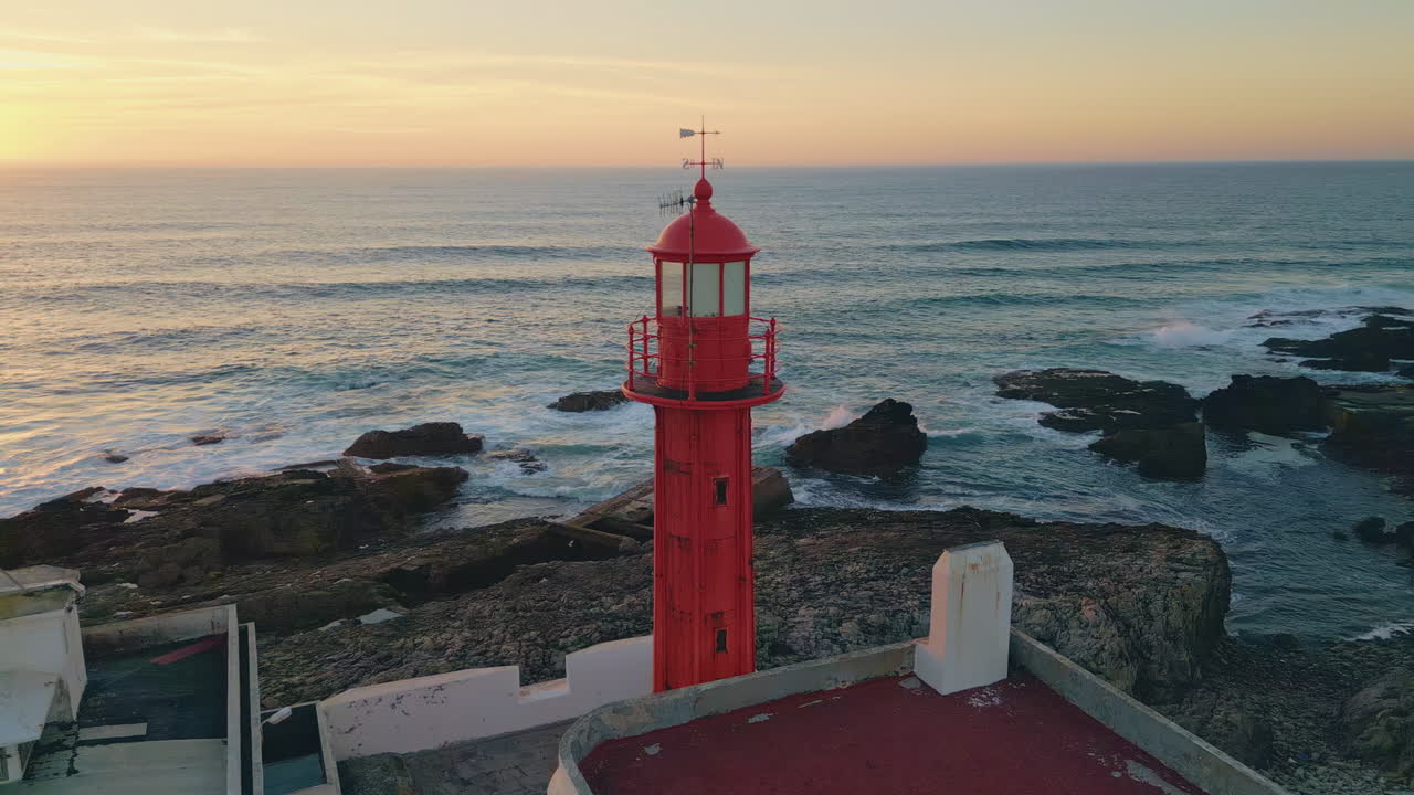 Sunrise scenery sea lighthouse drone view. Beautiful beacon standing rocky coast